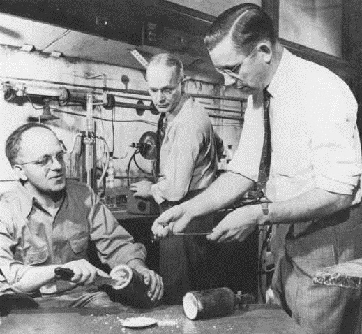 Reenactment of the 1938 discovery of Teflon. Left to right: Jack Rebok, Robert McHarness, and Roy Plunkett.